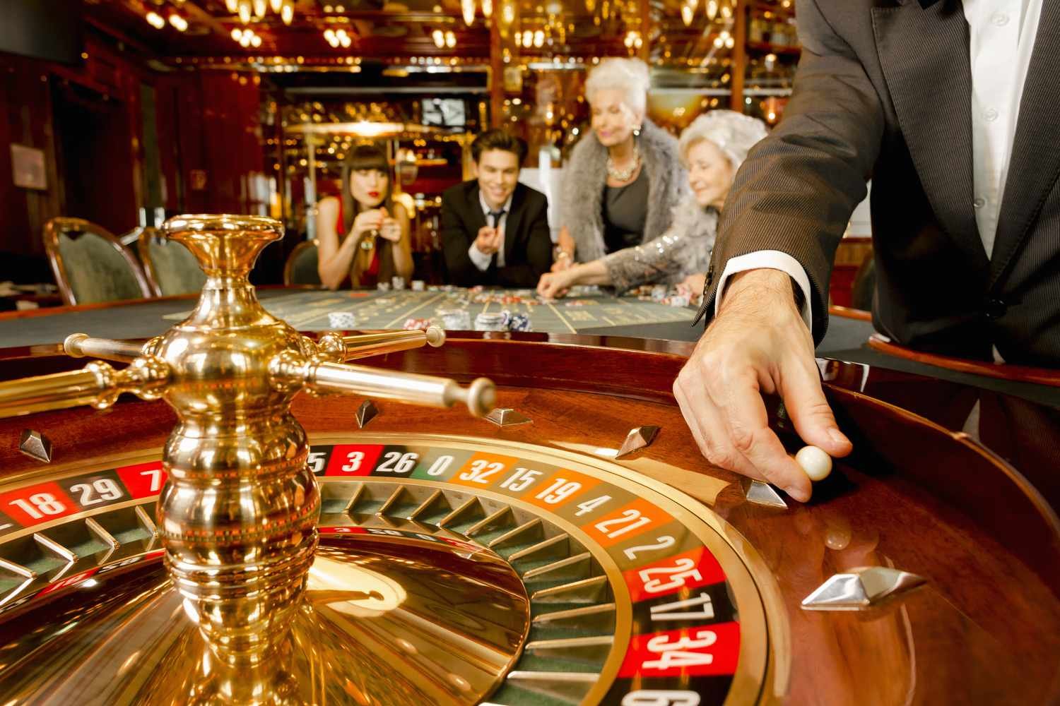 Close-up of live dealer cards and betting chips during SA Gaming baccarat session